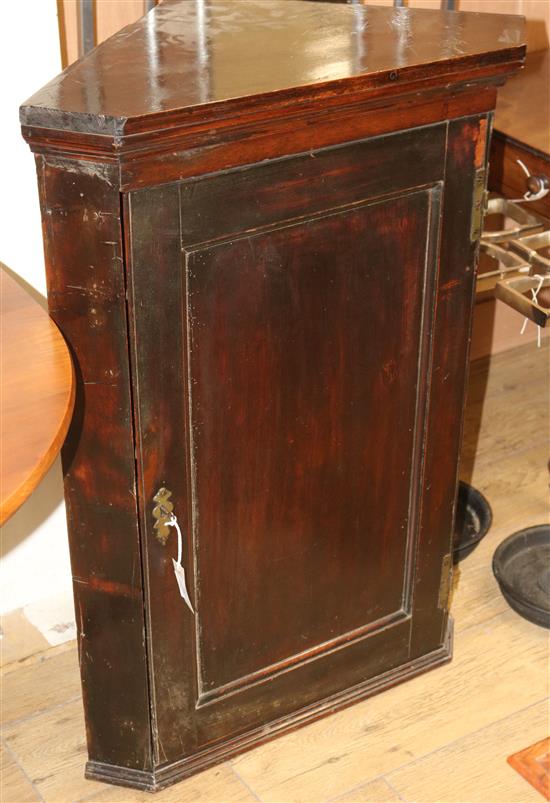 A dark wood corner cupboard W.71cm